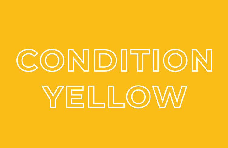 Yellow box for Condition Yellow in the Color Codes of Awareness system, representing relaxed alertness in self-defense awareness.