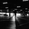 Man walking toward her car in dangerous parking lot, illustrating self defense awareness